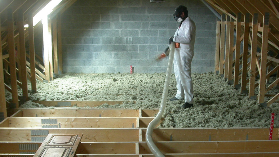 Blowing in loose-fill insulation and rule for measuring product thickness